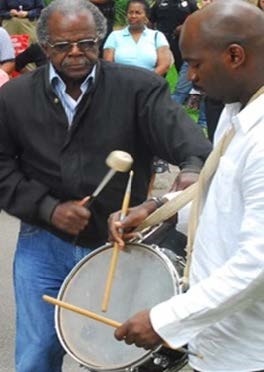 Two African American men drumming