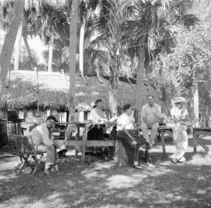 Seminole men waiting outside for Thanksgiving dinner.