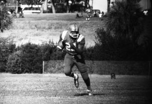 #23 Robert "Bob" Paremore running the ball during FAMU football game at Bragg Memorial Stadium in Tallahassee.